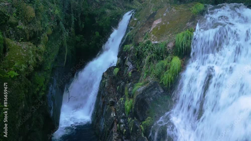 Foamy Cascades Of Santa Leocadia Waterfall In Mazaricos, Galicia Spain. Aerial Drone Shot Foamy Cascades Of Santa Leocadia Waterfall In Mazaricos, Galicia Spain. Aerial Drone Shot
