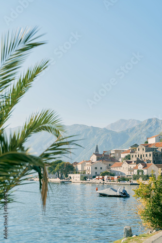 Motor boat in a cover stands on the pier in Perast. Montenegro © Nadtochiy
