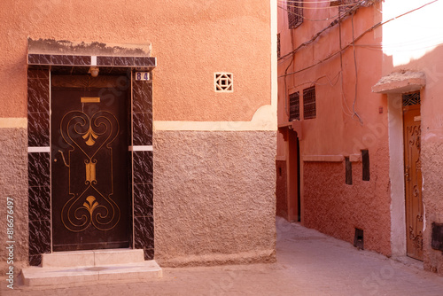 entrance wooden old carved doors Morocco in oriental style, traditional oriental shades, ornate wooden doorways in old city, Eastern craftsmanship