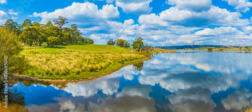 Reflections at Lake Oberon on a beauitful Autumn Day with blue sky and white clouds