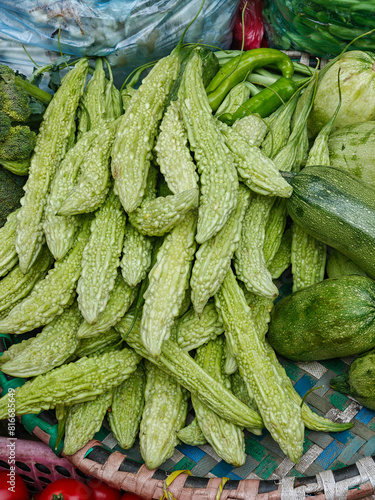 Green Momordica, bitter melon or karela for sale at outdoor farmers market. Kathmandu