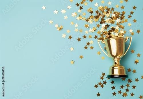 A gold cup with a star on it is surrounded by a lot of gold stars. The cup is placed on a blue background