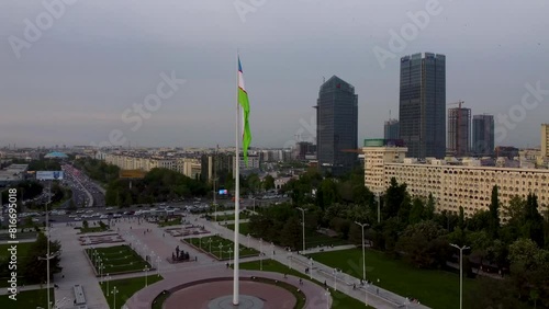 Uzbekistan National Flag at the Bunyodkor square in Tashkent city and Palace of Friendship of Peoples photo