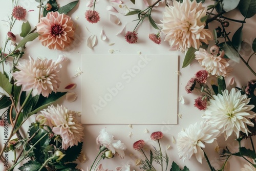a blank visit card surrounded by flowers. photo