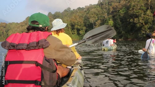 Watching the sunset with friends while canoeing at Situ Patenggang. photo