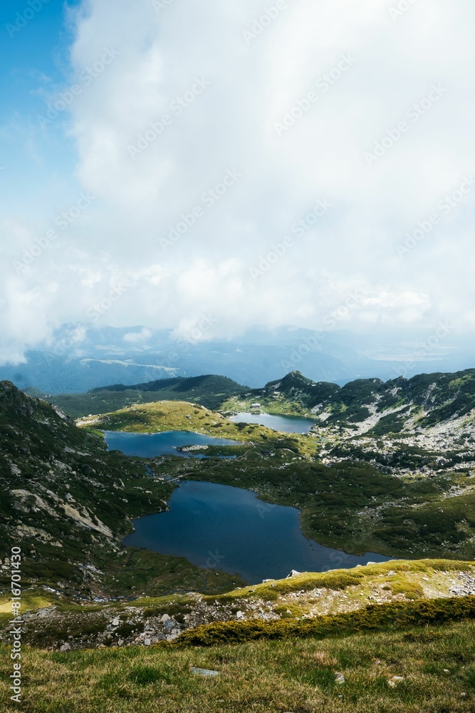 Obraz premium Stunning aerial view of the Seven Rila Lakes against a cloudy sky in Bulgaria