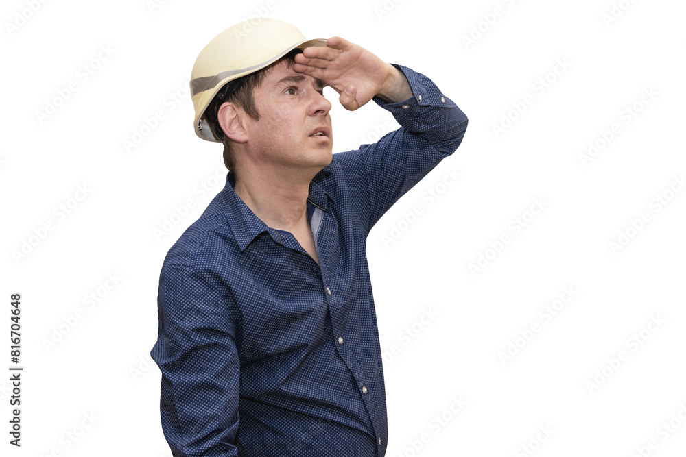 A man in a white hard hat intensely examines his hand, lost in thought. Isolated. A man in a white hard hat intensely examines his hand, lost in thought. Isolated.
