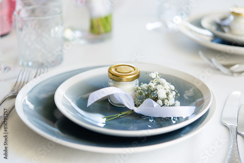 table and plate decor in a restaurant for a wedding event. stylish tablewear decorations photo