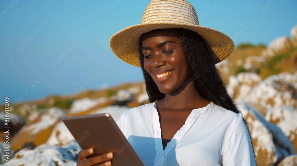 Fototapeta premium Smiling Woman Using Tablet Outdoors