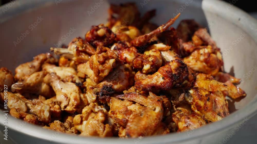 Delicious Grilled Chicken Wings. Close-up of succulent grilled chicken wings in bowl. Delicious Grilled Chicken Wings. Close-up of succulent grilled chicken wings in bowl.