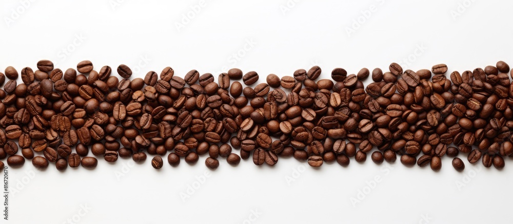 A top down copy space image of a Christmas tree crafted from roasted coffee beans on a white background ready for your messages A top down copy space image of a Christmas tree crafted from roasted coffee beans on a white background ready for your messages