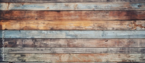 Street fence made of worn wooden boards Peeling paint reveals faded texture Ample empty area for copy space image