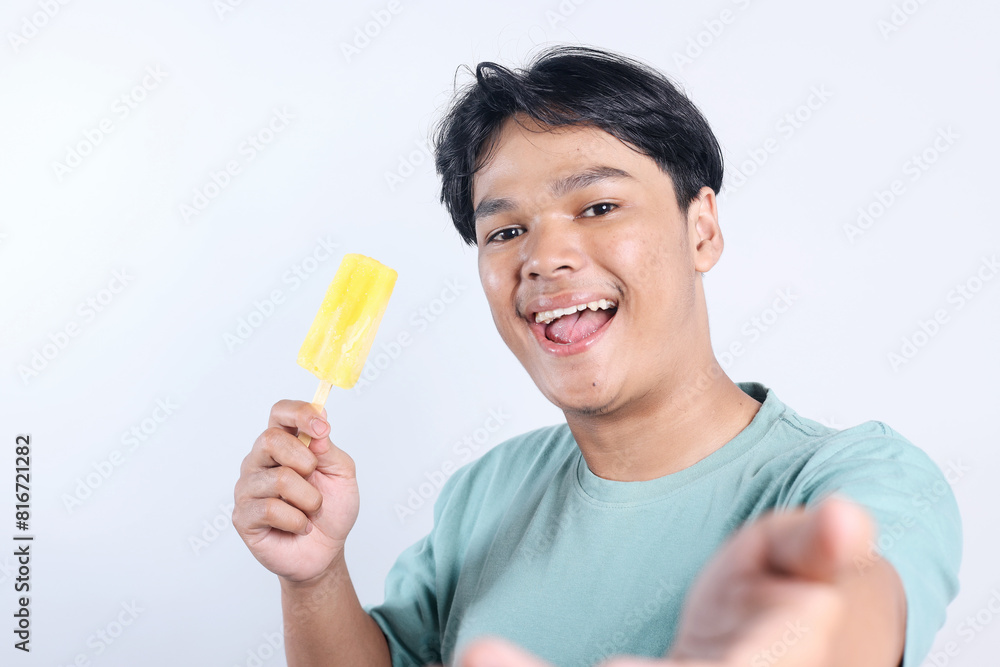 Potrait Of Cheerful Young Asian Guy Selfie At Camera While Holding Ice Cream Potrait Of Cheerful Young Asian Guy Selfie At Camera While Holding Ice Cream