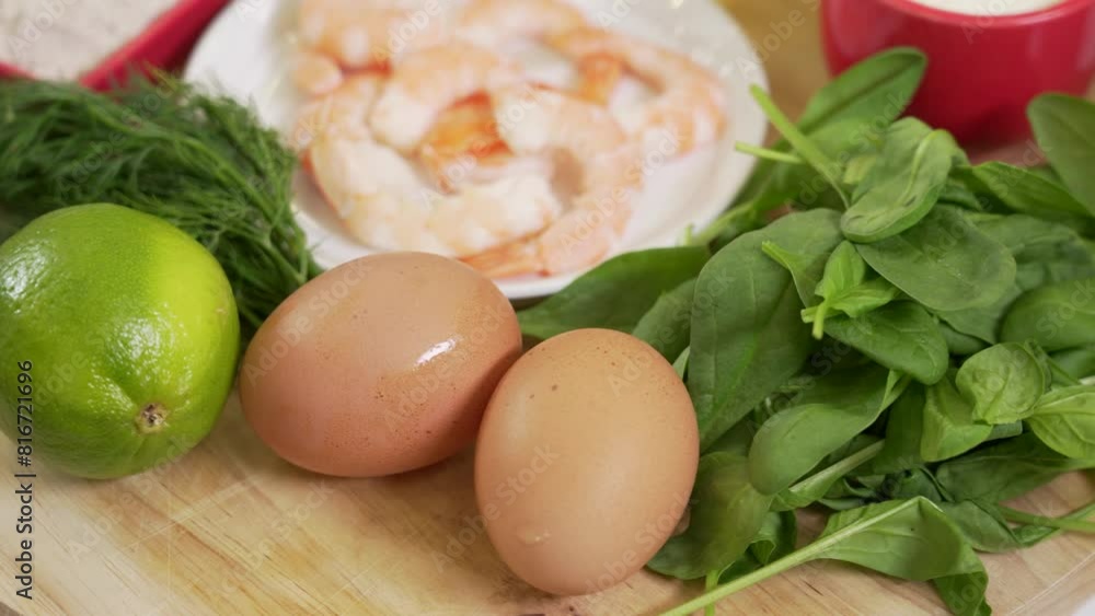 Fresh boiled shrimp in a bowl among other ingredients for the warm shrimp salad Fresh boiled shrimp in a bowl among other ingredients for the warm shrimp salad