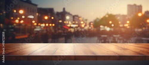 There is a copy space image of a table top with a blurred restaurant in the background