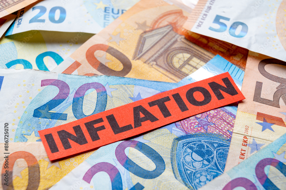 Euro banknotes background, with red ticket with text Inflation.
Euro banknotes background, with red ticket with text Inflation.