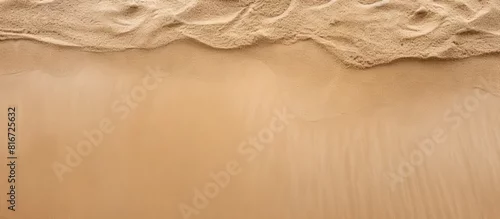 Panel kuchenny z motywem Top view of a sandy beach with a sand texture providing a copy space image