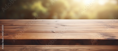 A wooden table is prominently showcased in the foreground while the background of the image is intentionally blurred to create a seamless visual effect This creates an ideal space for adding your adv