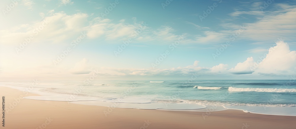 A serene empty beach emerges as the tide recedes offering a perfect backdrop for a copy space image