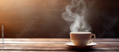 A copy space image showcasing a steaming cup of tea placed on a wooden table