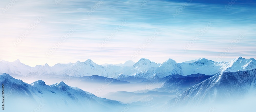 A stunning landscape of frozen mountain summits at sunrise enveloped in a serene fog. with copy space image. Place for adding text or design A stunning landscape of frozen mountain summits at sunrise enveloped in a serene fog. with copy space image. Place for adding text or design