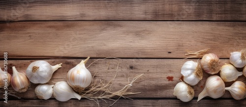 Wooden background with granulated dried garlic providing ample copy space for a striking image