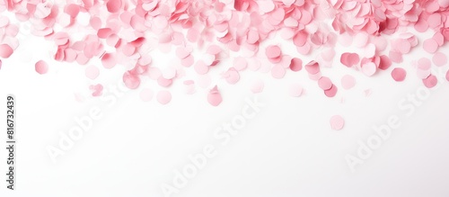 A soft pink confetti gently...