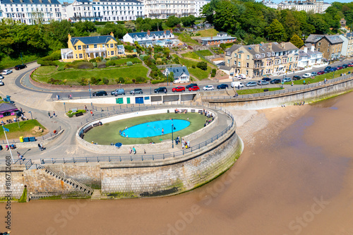 Aerial photo of the beautiful town of Filey in the UK, showing the beach front and open air public swimming pool on a sunny summers day