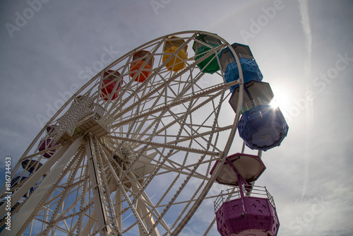 Obraz na plátně Illuminated ferris wheel with vibrant rides in Tibidabo, Barcelona, Spain
