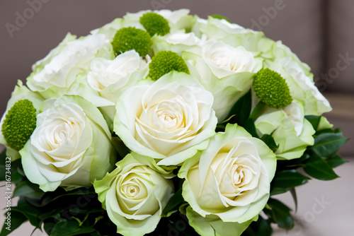 bouquet of roses. A large beautiful bouquet of white roses stands on a gray background  close-up top view flowers concept