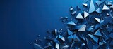 The triangular arrangement of metal fragments resembling a screwdriver is scattered on a blue background allowing for ample empty space
