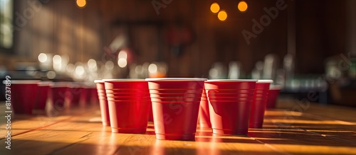 A copy space image showcasing game cups for Beer Pong placed on a table 67 characters