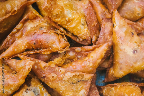 Fried samosas in a street food stall in Bengaluru, India. © DiversePixels
