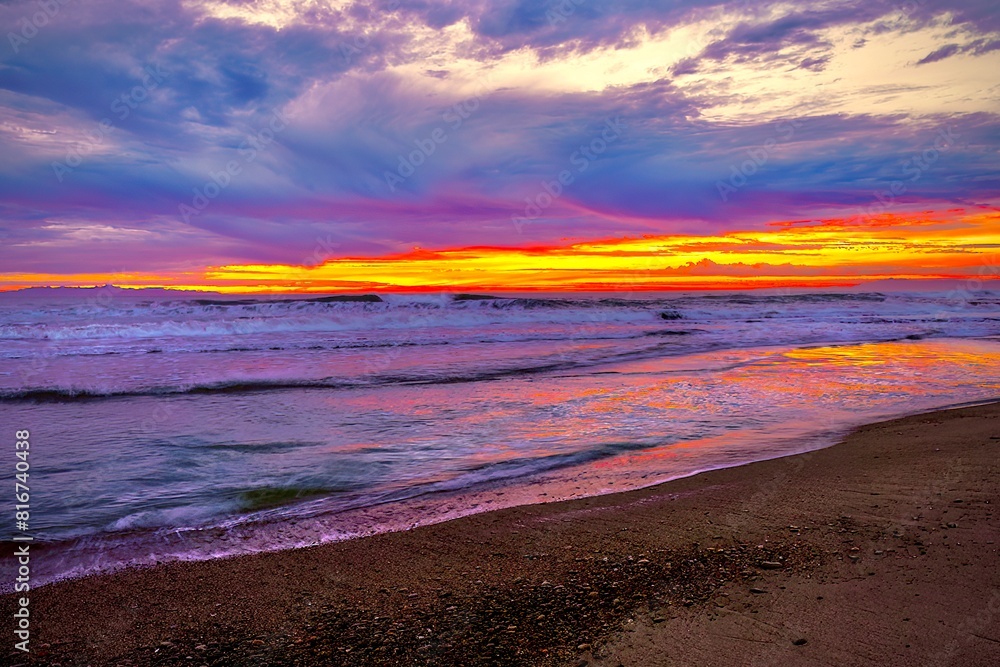 Beautiful ocean landscape at sunset, with rolling waves and a vibrant orange sky in the background. Beautiful ocean landscape at sunset, with rolling waves and a vibrant orange sky in the background.