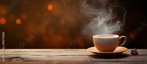 A copy space image showcasing a steaming cup of tea placed on a wooden table