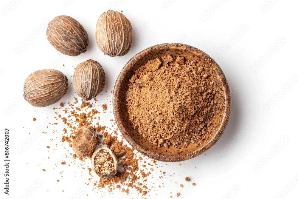 A bowl of nutmeal next to nuts on a white surface. Suitable for food and nutrition concepts A bowl of nutmeal next to nuts on a white surface. Suitable for food and nutrition concepts