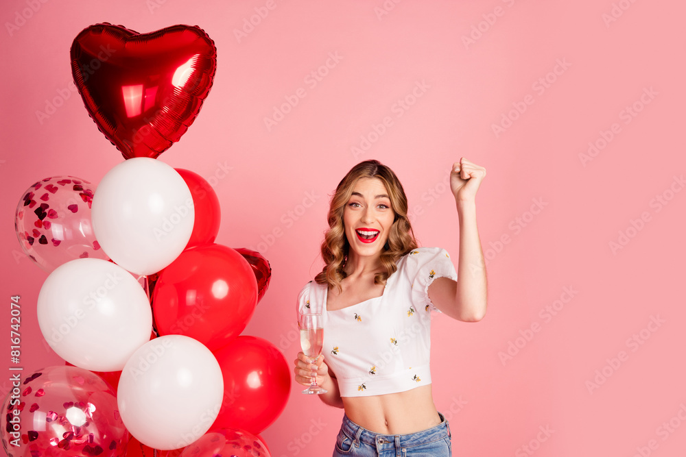 Photo portrait of lovely young woman balloons hold champagne win dressed stylish white garment hairdo isolated on pink color background Photo portrait of lovely young woman balloons hold champagne win dressed stylish white garment hairdo isolated on pink color background