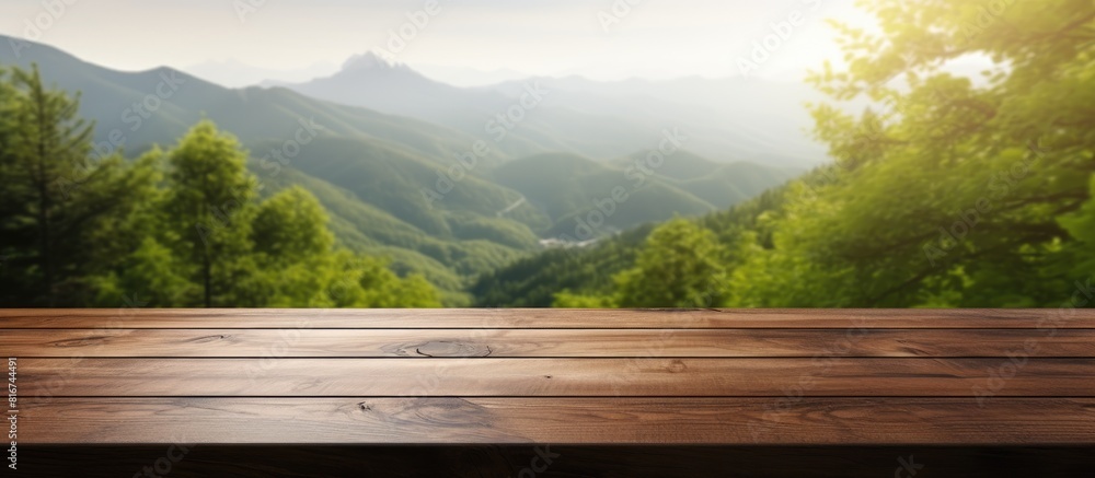 Scenic wooden table or desk with nature backdrop featuring a mountain view and a beautiful bokeh effect There s plenty of room for your text on the copy space image Scenic wooden table or desk with nature backdrop featuring a mountain view and a beautiful bokeh effect There s plenty of room for your text on the copy space image