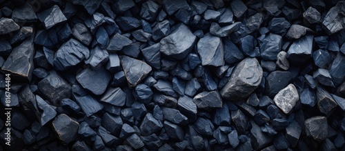 Wallpaper Mural A top down view of a textured background made of dark navy blue stones with an area available for adding an image or text. with copy space image. Place for adding text or design Torontodigital.ca