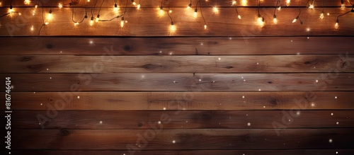 A vintage wooden background with illuminated lights perfect for Christmas decorations and plenty of space for your own images or text. with copy space image. Place for adding text or design photo