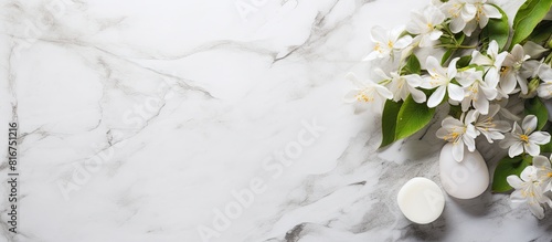 A flat lay composition featuring jasmine flowers a set of spa essentials and a white marble table Ample copy space is available for text