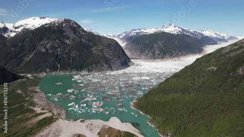 Drone footage of a glacier lake at Baird Glacier on a sunny day in Thomas Bay, Petersburg, Alaska photo