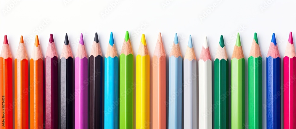 Copy space image with an assortment of crayons and pastels neatly arranged on a white background Copy space image with an assortment of crayons and pastels neatly arranged on a white background