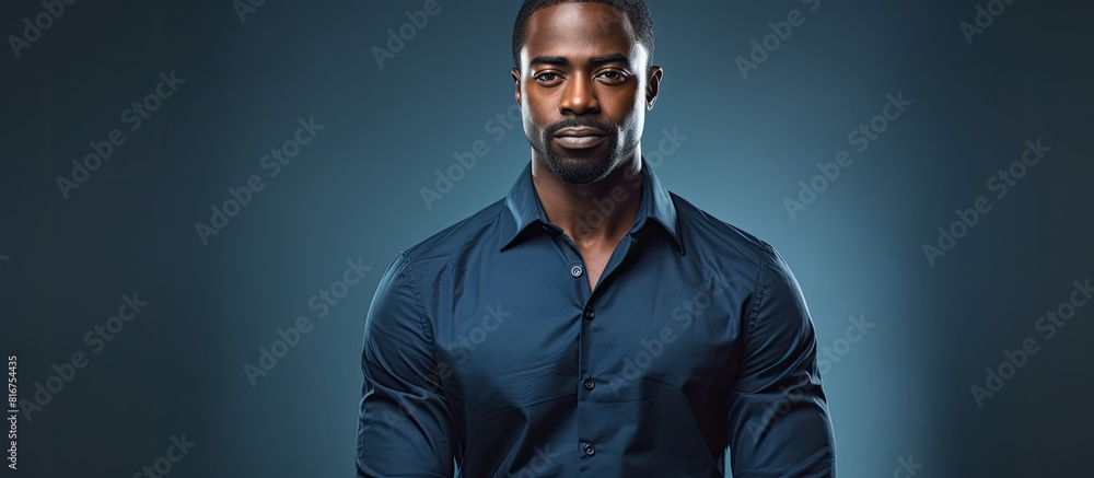 An attractive African American man posing in a studio with a copy space background An attractive African American man posing in a studio with a copy space background