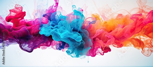 Vibrant colored ink swirling in water creates an abstract and colorful background resembling a fancy dream cloud of ink beneath the surface Ideal for a copy space image
