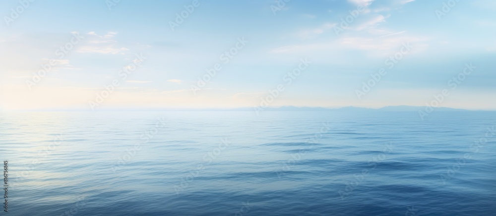 Fototapeta premium A serene abstract view of the ocean s tranquil surface in the early morning offering ample copy space for creative use