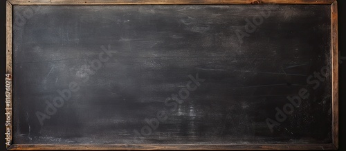 Image of a blank chalkboard with erased marks providing a clean surface for educational purposes. copy space available photo