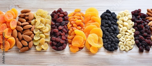 Mixed dried fruits on a old white wooden table. copy space available