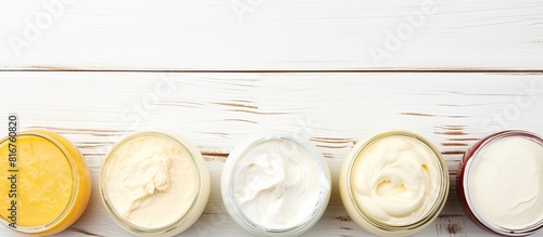 dairy product samples on white wood table background