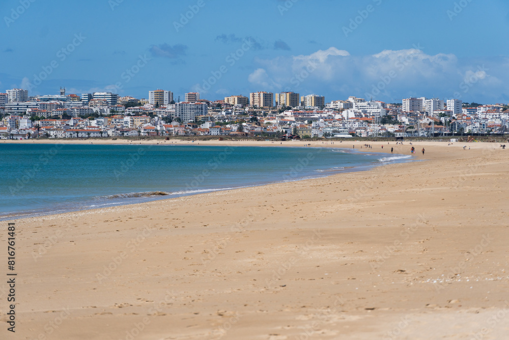 Meia Praia beach in Lagos, Algarve, Portugal. Crystal clear sea water. Sunny day.